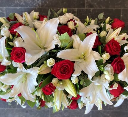 "Red and White Casket Spray – Elegant Handcrafted Funeral Flower Arrangement"