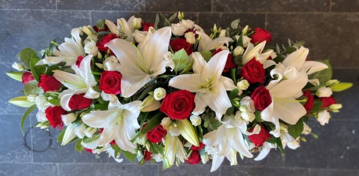 "Red and White Casket Spray – Elegant Handcrafted Funeral Flower Arrangement"